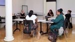 People in a classroom having a discussion.