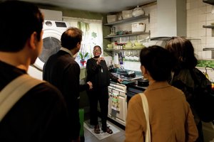 Homeowner giving tour of stove.